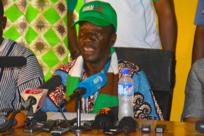Wilmot Paye addressing a news conference