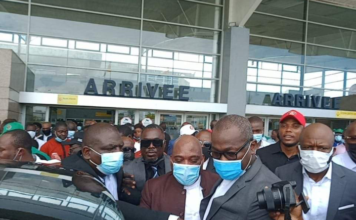 Ex-Ivorian officials return home after decade in exile