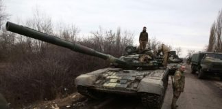 Ukrainian servicemen  to respond to a Russian attack in Ukraine’s Lugansk region