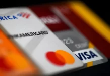 Americans are piling up credit card debt — and it could prove very costly photo of creditcard