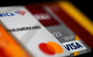 Americans are piling up credit card debt — and it could prove very costly photo of creditcard