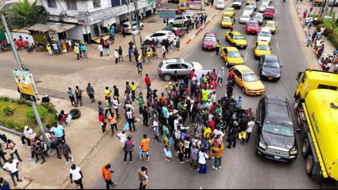 A handful of protesters in the street on Wednesday in Monrovia