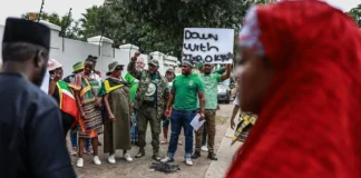 Nigeria warns its citizens in South Africa to be cautious after march turns violent